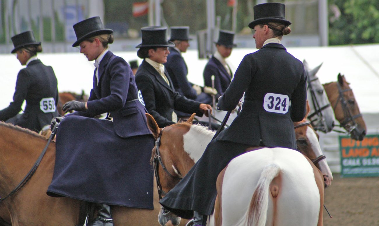Women riding side saddle
